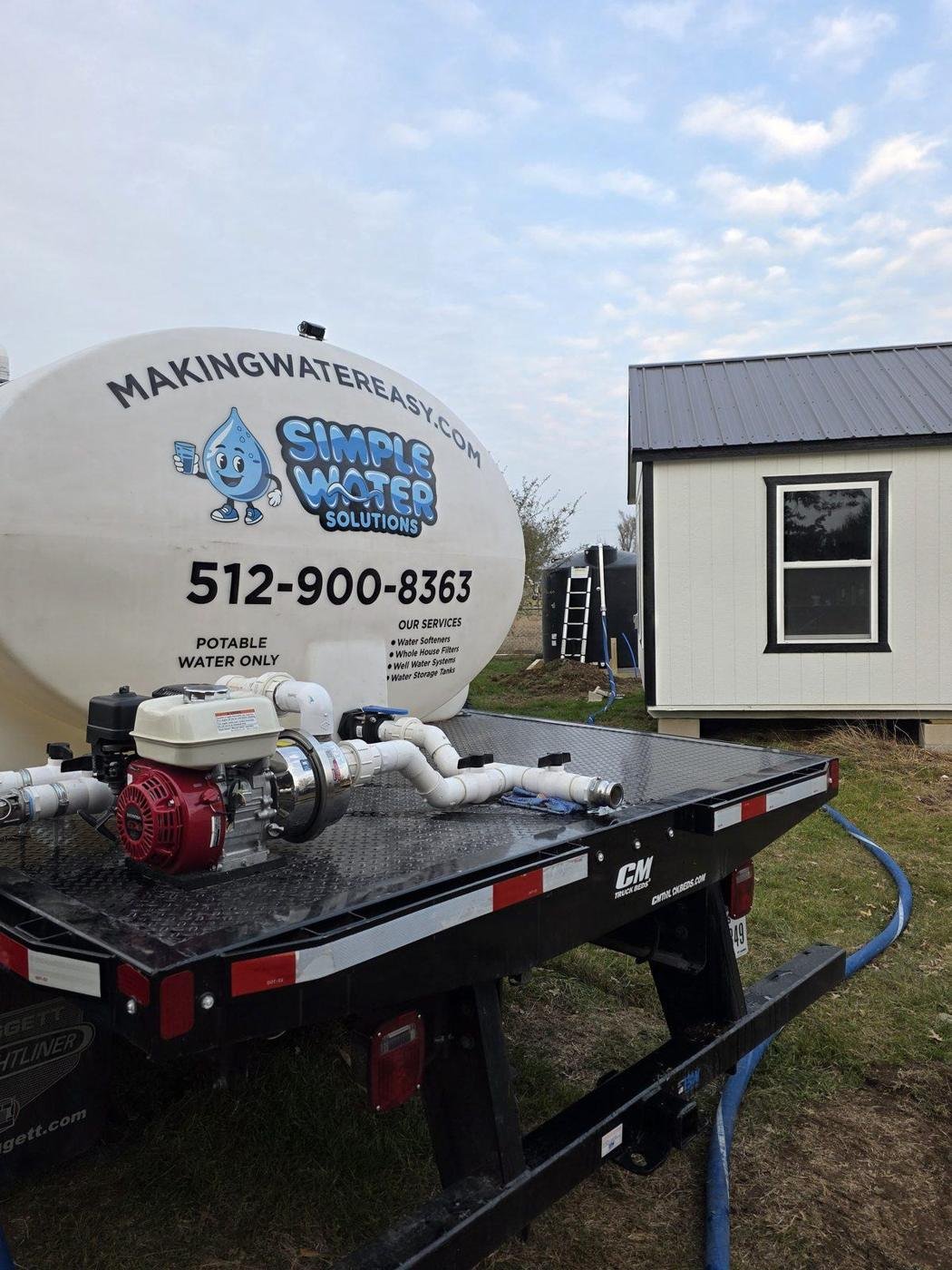 Simple Water Solutions water truck on site to fill a newly installed storage tank